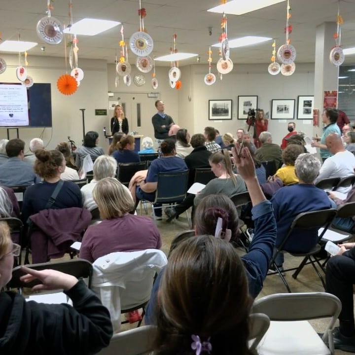 Givaudan officials answer questions from neighbors during Monday night's meeting